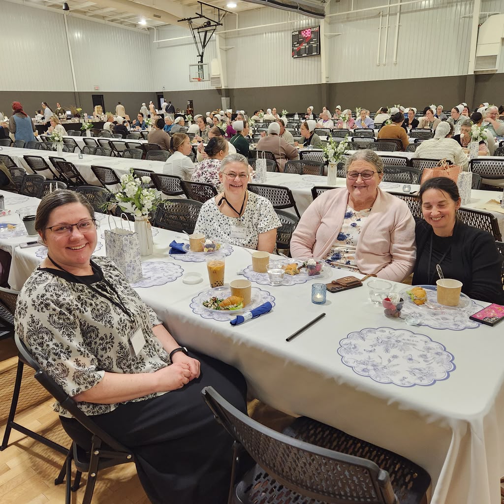 Women gathered together in the fellowship hall at a previous retreat